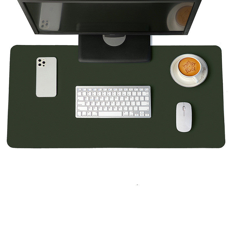 Dark green desk mat and mouse pad set with monitor, keyboard, and coffee, ideal for a clean and stylish workspace.
